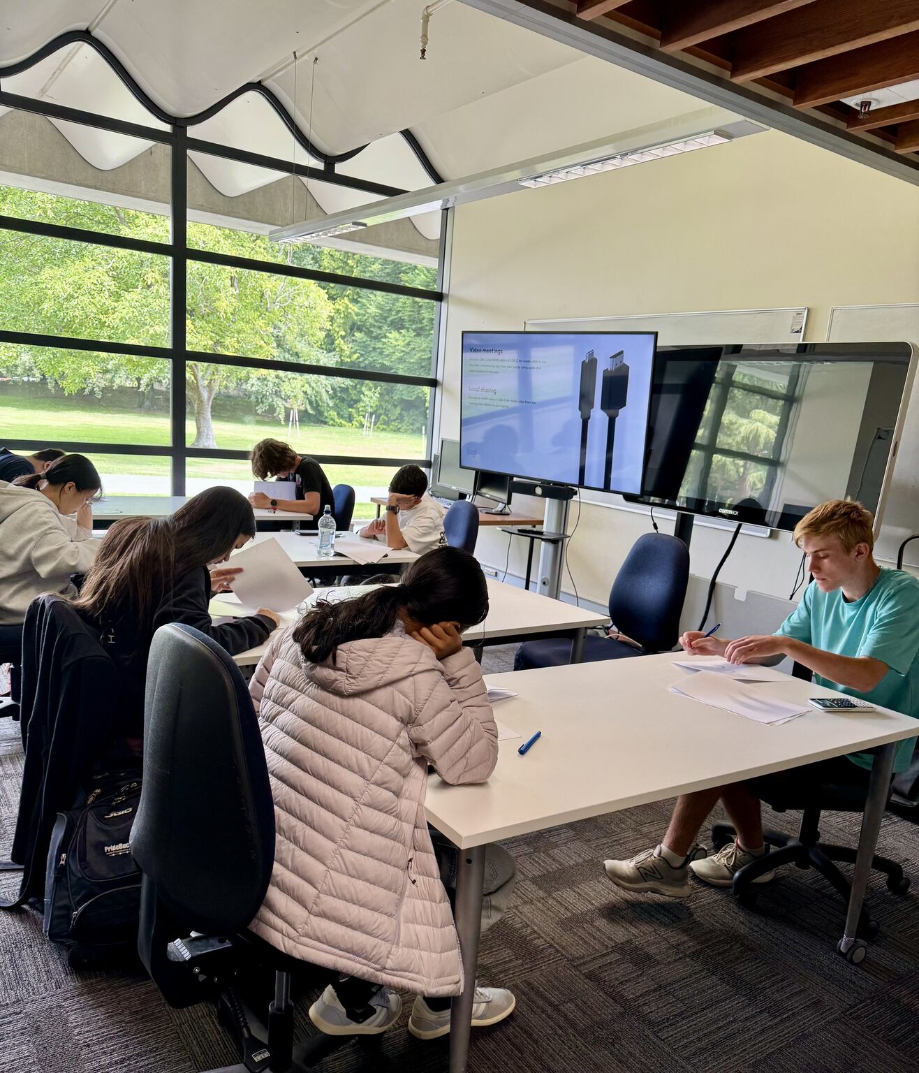 Students working through AI olympiad problems